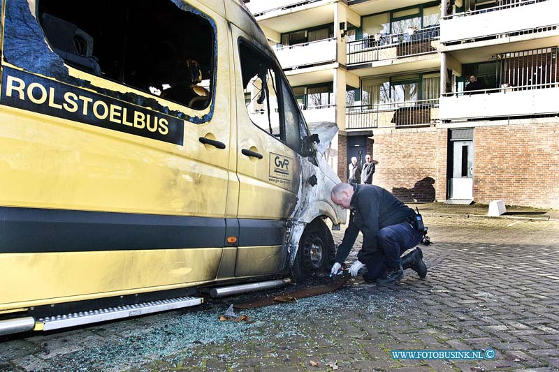 170102606.jpg - DORDRECHT - Op maandag 2 januari 2017 was een forensische onderzoeker van de politie bezig aan de Blaauwweg in Dordrecht om de twee verwoeste rolstoelbussen te onderzoeken die op oudejaarsavond in de brand werden gestoken.de verslagenheid van de chauffeurs en buurtbewoners is groot de mensen zijn zwaar teleur gesteld over dit incident en hopen dat er snel een verantwoordelijke wordt aangehouden.Deze digitale foto blijft eigendom van FOTOPERSBURO BUSINK. Wij hanteren de voorwaarden van het N.V.F. en N.V.J. Gebruik van deze foto impliceert dat u bekend bent  en akkoord gaat met deze voorwaarden bij publicatie.EB/ETIENNE BUSINK